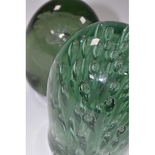 387 - TWO VICTORIAN GREEN GLASS DUMP WEIGHTS, the larger with controlled bubble inclusions, height 12cm, c... 