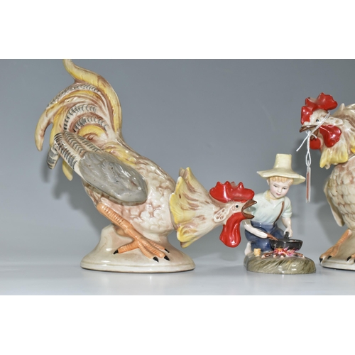 391 - TWO 20TH CENTURY CONTINENTAL PORCELAIN FIGURES OF COCKERELS, posed as ready to fight each other, mod... 