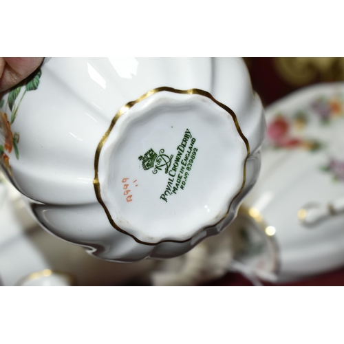 402 - A BOXED ROYAL CROWN DERBY TEA FOR TWO SET, with Derby posies teapot and the cups, saucers, milk, sug... 