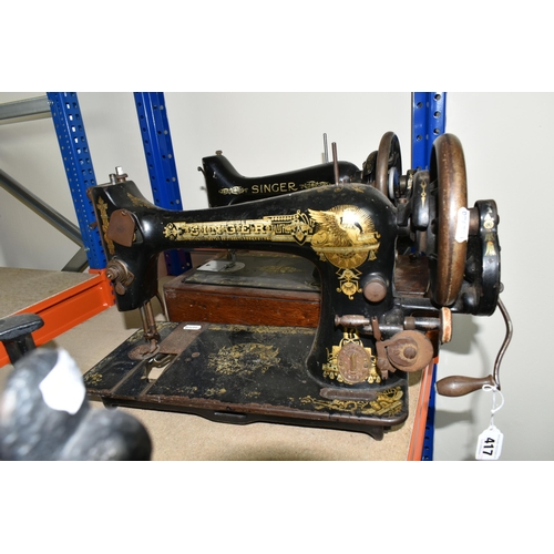 417 - A LARGE ORNATE CAST IRON BOOT SCRAPER AND TWO SINGER SEWING MACHINES, comprising a Victorian cast ir... 