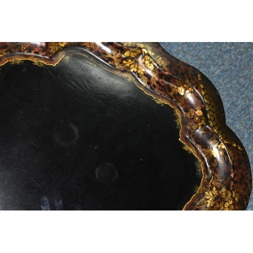 506 - A LARGE VICTORIAN BLACK LACQUERED PAPIER MACHE TRAY, with gilt foliate border decoration, width 80.5... 