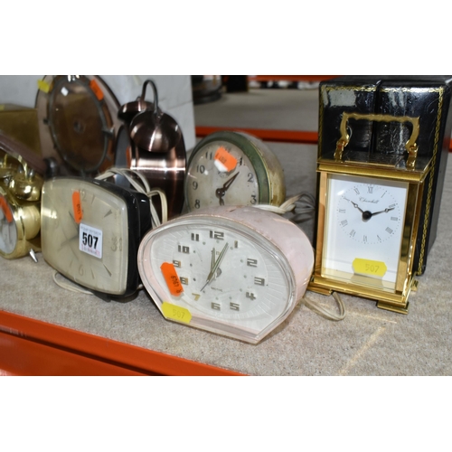 507 - A COLLECTION OF SMALL CLOCKS, nineteen alarm, mantel, carriage, anniversary and desk clocks, mainly ... 