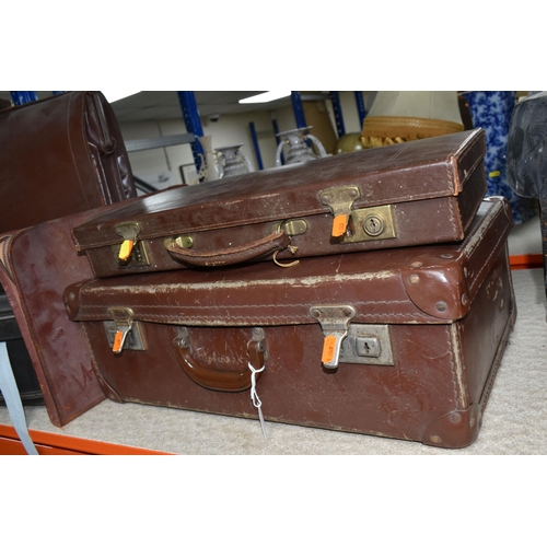 517 - A GROUP OF SUITCASES AND BRIEFCASES, to include a small brown vintage suitcase, width 50cm x height ... 