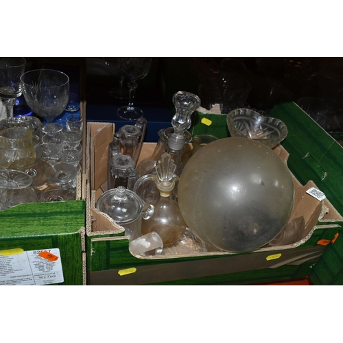 520 - FIVE BOXES AND LOOSE GLASS WARE, to include a vintage decanter and glass set decorated in a geometri... 