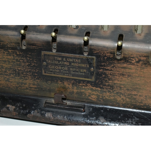 564 - A T.I.M. MECHANICAL CALCULATING MACHINE, black casing in worn condition with paint loss, surface rus... 