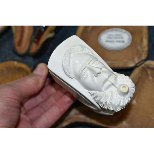 587 - A BOX OF CASED REPRODUCTION MEERSCHAUM PIPES, comprising cased pipes in the forms of a mastiff type ... 