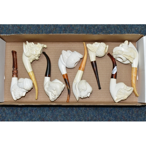 588 - A BOX OF REPRODUCTION MEERSCHAUM PIPES, comprising eight pipes: five carved with different male face... 