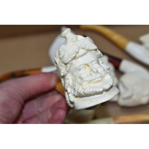 588 - A BOX OF REPRODUCTION MEERSCHAUM PIPES, comprising eight pipes: five carved with different male face... 