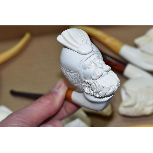 588 - A BOX OF REPRODUCTION MEERSCHAUM PIPES, comprising eight pipes: five carved with different male face... 