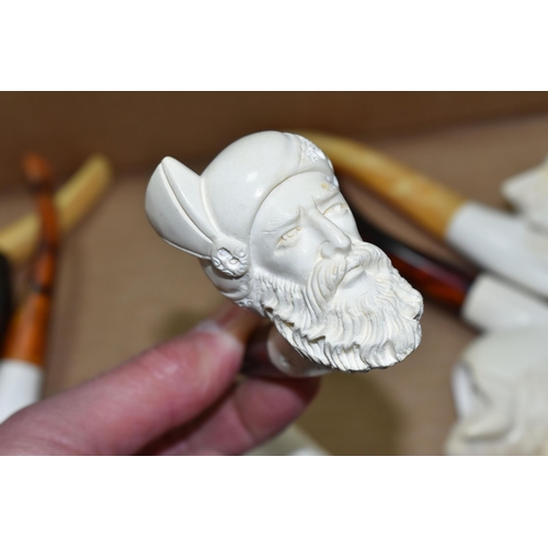 588 - A BOX OF REPRODUCTION MEERSCHAUM PIPES, comprising eight pipes: five carved with different male face... 