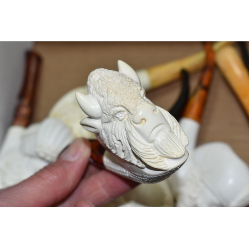 588 - A BOX OF REPRODUCTION MEERSCHAUM PIPES, comprising eight pipes: five carved with different male face... 