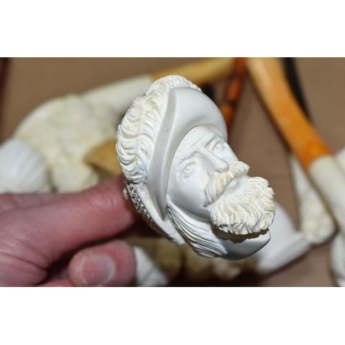 588 - A BOX OF REPRODUCTION MEERSCHAUM PIPES, comprising eight pipes: five carved with different male face... 