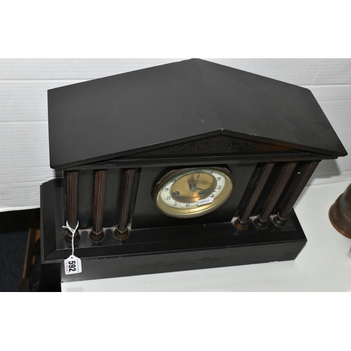 592 - A BLACK SLATE CASED MANTEL CLOCK, of architectural form, the dial bearing Arabic numerals, with key ... 