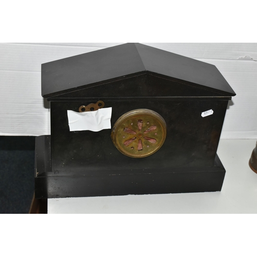 592 - A BLACK SLATE CASED MANTEL CLOCK, of architectural form, the dial bearing Arabic numerals, with key ... 