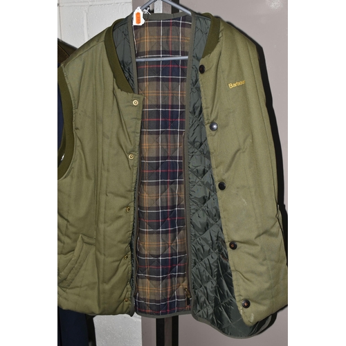 612 - A BROWN BARBOUR CLASSIC BEAUFORT WAX JACKET WITH DETACHABLE HOOD, together with two green quilted Ba... 