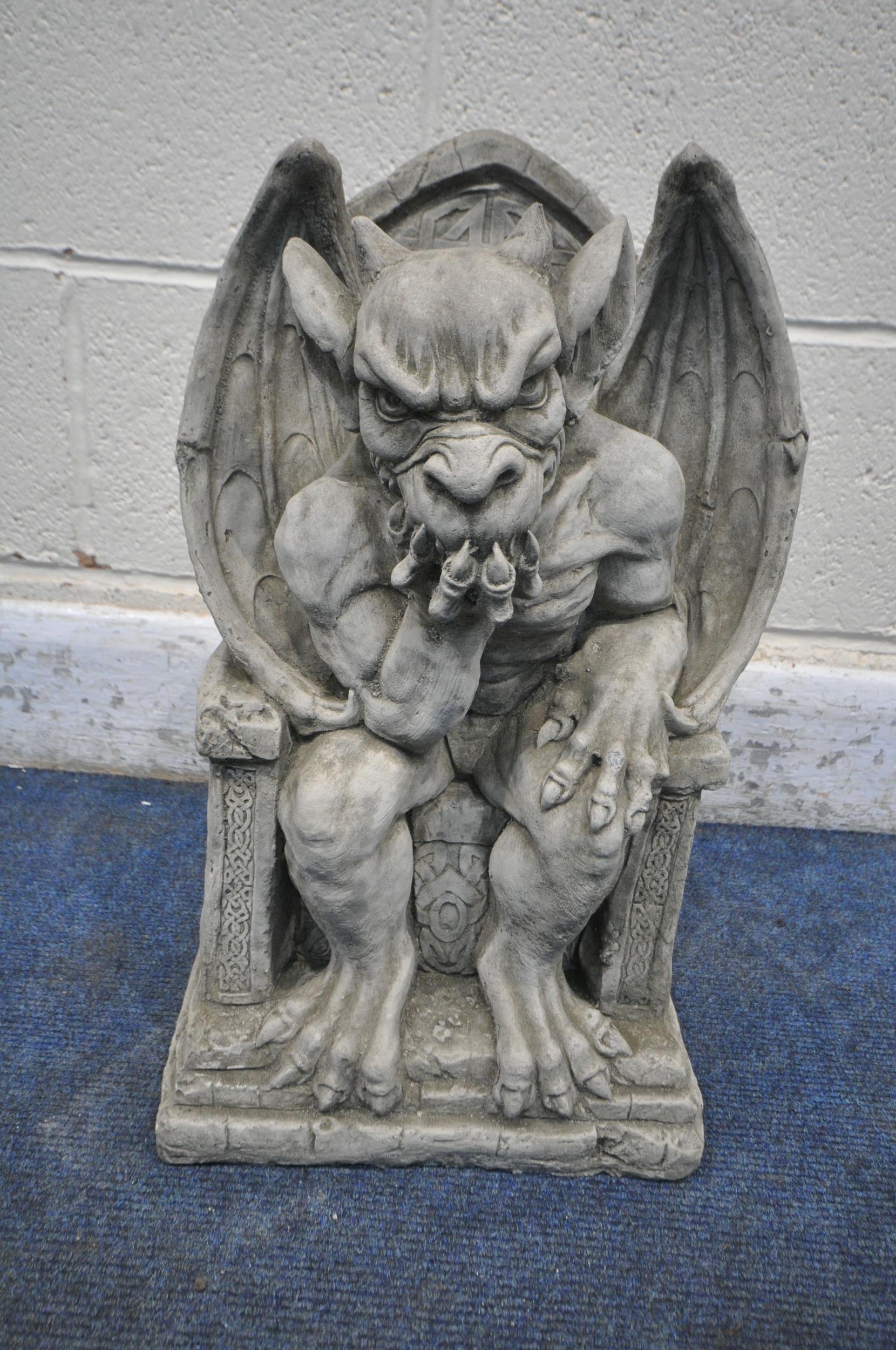 A MODERN COMPOSITE GROTESQUE, seated on a throne width 30cm x depth ...