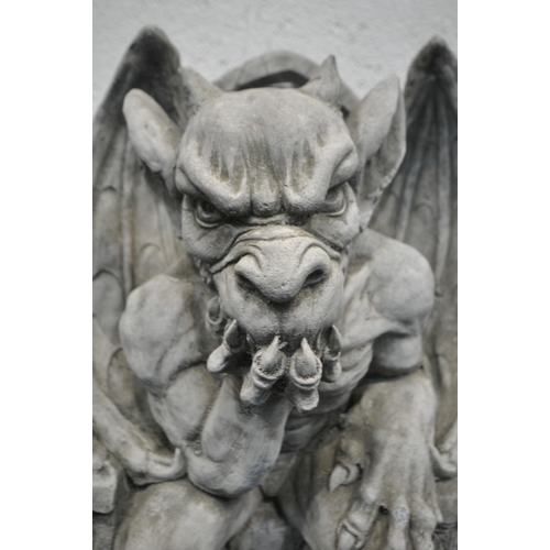 A MODERN COMPOSITE GROTESQUE, seated on a throne width 30cm x depth ...