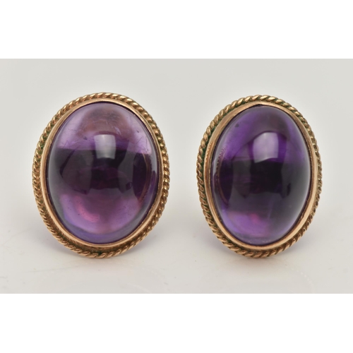 1 - A PAIR OF AMETHYST CABOCHON STUD EARRINGS, the oval cabochon in a collet setting with rope twist sur... 