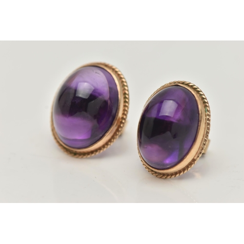 1 - A PAIR OF AMETHYST CABOCHON STUD EARRINGS, the oval cabochon in a collet setting with rope twist sur... 