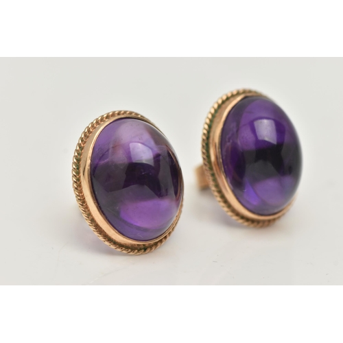 1 - A PAIR OF AMETHYST CABOCHON STUD EARRINGS, the oval cabochon in a collet setting with rope twist sur... 