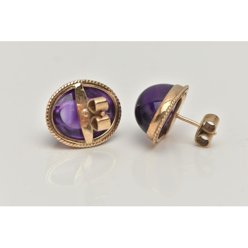 1 - A PAIR OF AMETHYST CABOCHON STUD EARRINGS, the oval cabochon in a collet setting with rope twist sur... 