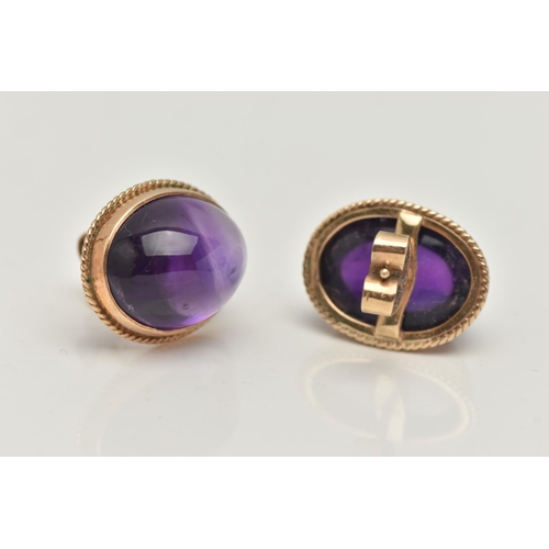 1 - A PAIR OF AMETHYST CABOCHON STUD EARRINGS, the oval cabochon in a collet setting with rope twist sur... 