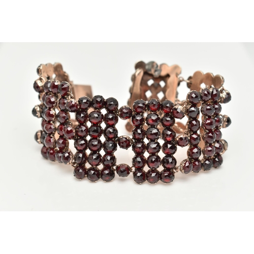 13 - A LATE 19TH CENTURY BOHEMIAN GARNET BRACELET, designed as rectangular faceted garnet set panels, to ... 