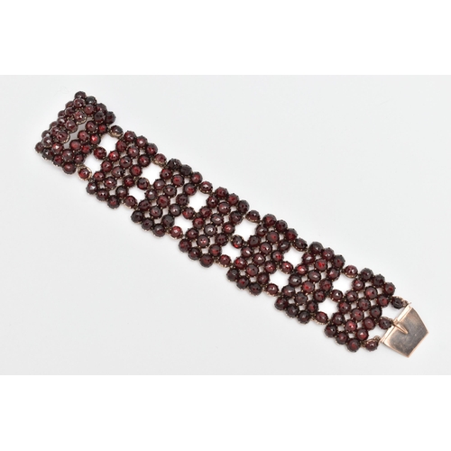 13 - A LATE 19TH CENTURY BOHEMIAN GARNET BRACELET, designed as rectangular faceted garnet set panels, to ... 