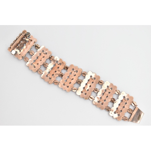 13 - A LATE 19TH CENTURY BOHEMIAN GARNET BRACELET, designed as rectangular faceted garnet set panels, to ... 