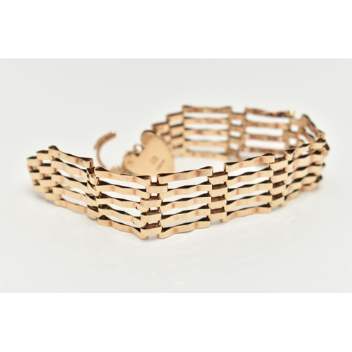 23 - A 9CT GOLD GATE BRACELET, five bar bracelet, approximate width 15.8mm, fitted with a heart padlock c... 
