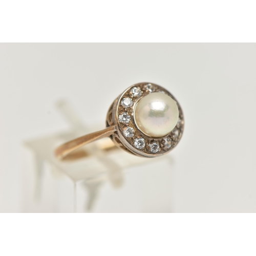 5 - A 9CT GOLD CLUSTER RING, designed as a central cultured pearl, within a circular cut cubic zirconia ... 