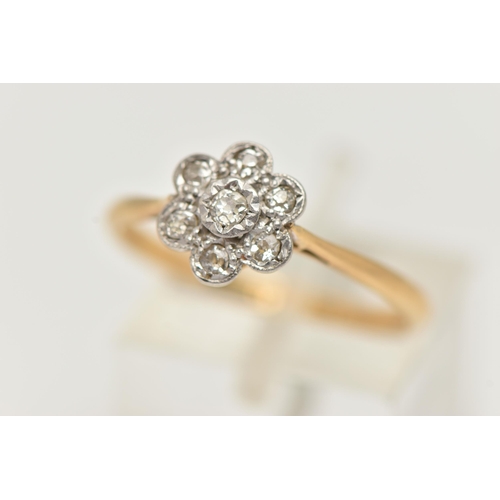 50 - A YELLOW AND WHITE METAL DIAMOND FLOWER RING, white metal flower head set with seven small single cu... 