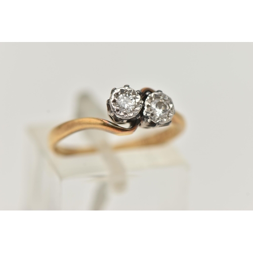 53 - AN 18CT GOLD DIAMOND TWO STONE RING, cross over ring, set with two round brilliant cut diamonds, eac... 