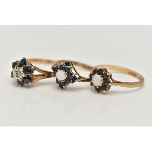 55 - THREE 9CT GOLD GEM SET RINGS, the first an opal and dark blue sapphire cluster ring, hallmarked 9ct ... 