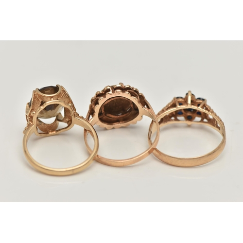 58 - THREE 9CT GOLD RINGS, the first an oval cut smoky quartz ring, measuring approximately 11.4mm x 9.1m... 