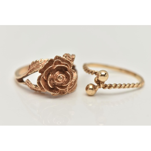 61 - TWO YELLOW METAL RINGS, the first in the form of a textured rose, bifurcated shoulders leading onto ... 