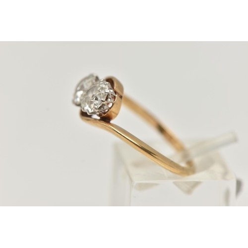 62 - A YELLOW METAL DIAMOND TWO STONE RING, two old  cut diamonds, each in a ten claw white metal setting... 