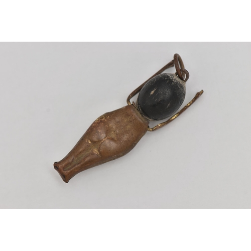 71 - A WWI FUMSUP CHARM, wooden head and metal body with moveable arms, approximate length 31mm, (conditi... 