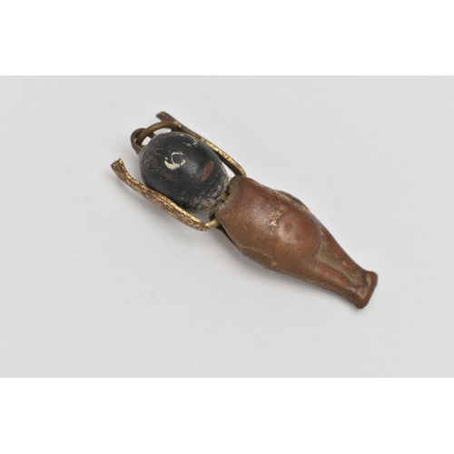 71 - A WWI FUMSUP CHARM, wooden head and metal body with moveable arms, approximate length 31mm, (conditi... 