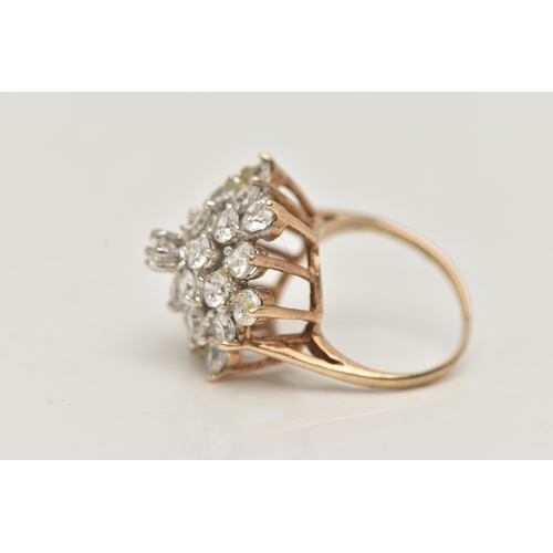 8 - A 9CT GOLD CUBIC ZIRCONIA CLUSTER RING, designed as four tiers of claw set, circular colourless cubi... 