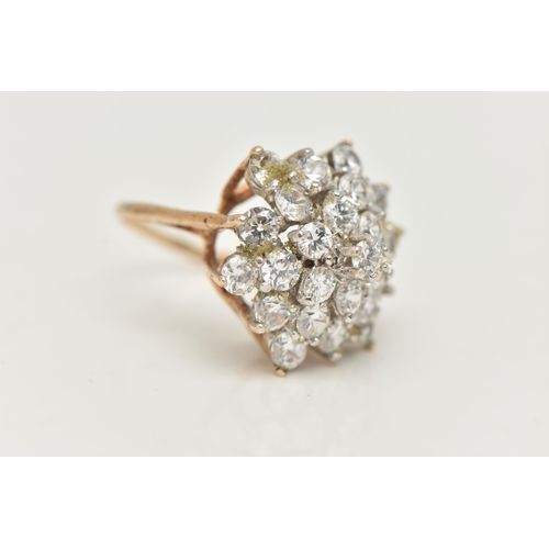 8 - A 9CT GOLD CUBIC ZIRCONIA CLUSTER RING, designed as four tiers of claw set, circular colourless cubi... 