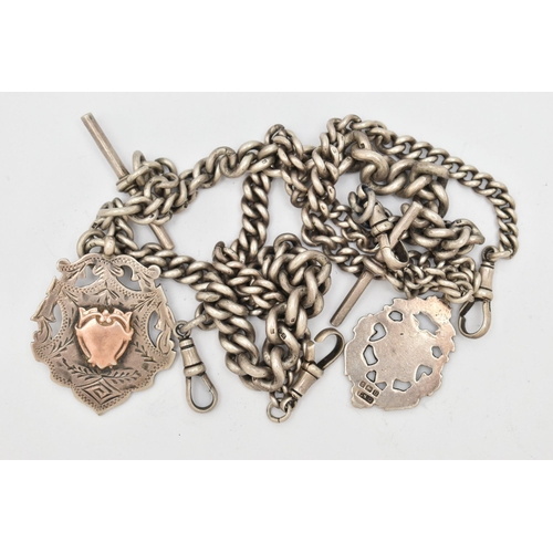 100 - TWO EARLY 20TH CENTURY SILVER ALBERT CHAINS WITH FOBS AND T-BARS, both of graduated curb link design... 