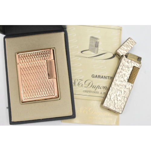 109 - TWO LIGHTERS, to include a boxed gold plated 'S.T.Dupont' engine turned pattern lighter, signed to t... 