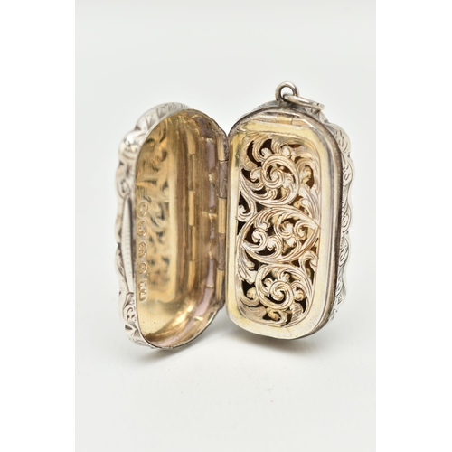 111 - A LATE VICTORIAN SILVER VINAGRETTE, wavy rectangular form, floral pattern with vacant cartouche to o... 