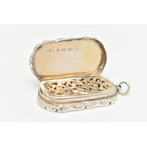 111 - A LATE VICTORIAN SILVER VINAGRETTE, wavy rectangular form, floral pattern with vacant cartouche to o... 