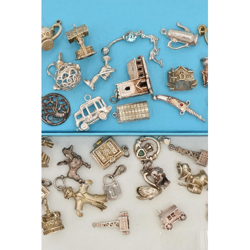 118 - ASSORTED SILVER AND WHITE METAL CHARMS, to include a silver ingot, hallmarked Birmingham, approximat... 