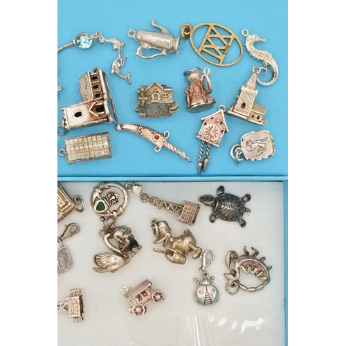 118 - ASSORTED SILVER AND WHITE METAL CHARMS, to include a silver ingot, hallmarked Birmingham, approximat... 