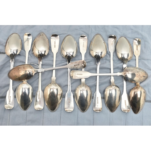 135 - A MATCHED SET OF TWELVE GEORGE IV TO VICTORIAN SILVER FIDDLE PATTERN TABLESPOONS, including a pair b... 