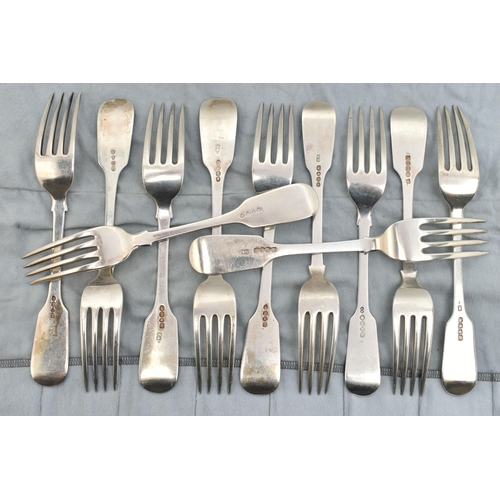 136 - A MATCHED SET OF ELEVEN GEORGE IV TO VICTORIAN SILVER FIDDLE PATTERN TABLE FORKS, including a set of... 