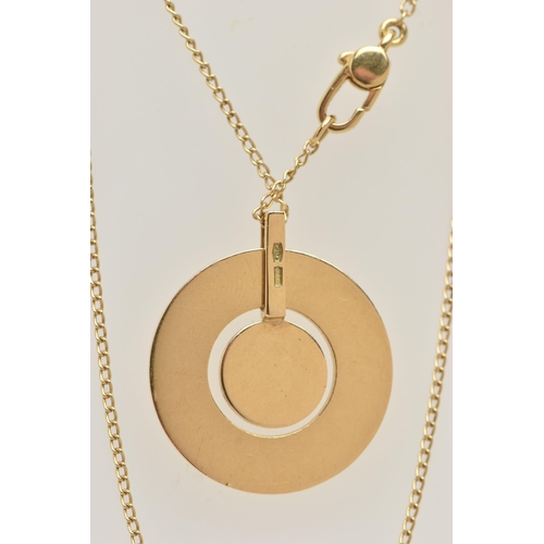 78 - A 'GUCCI' ICON NECKLACE, a yellow metal circular disk pendant with a moveable central disk, approxim... 